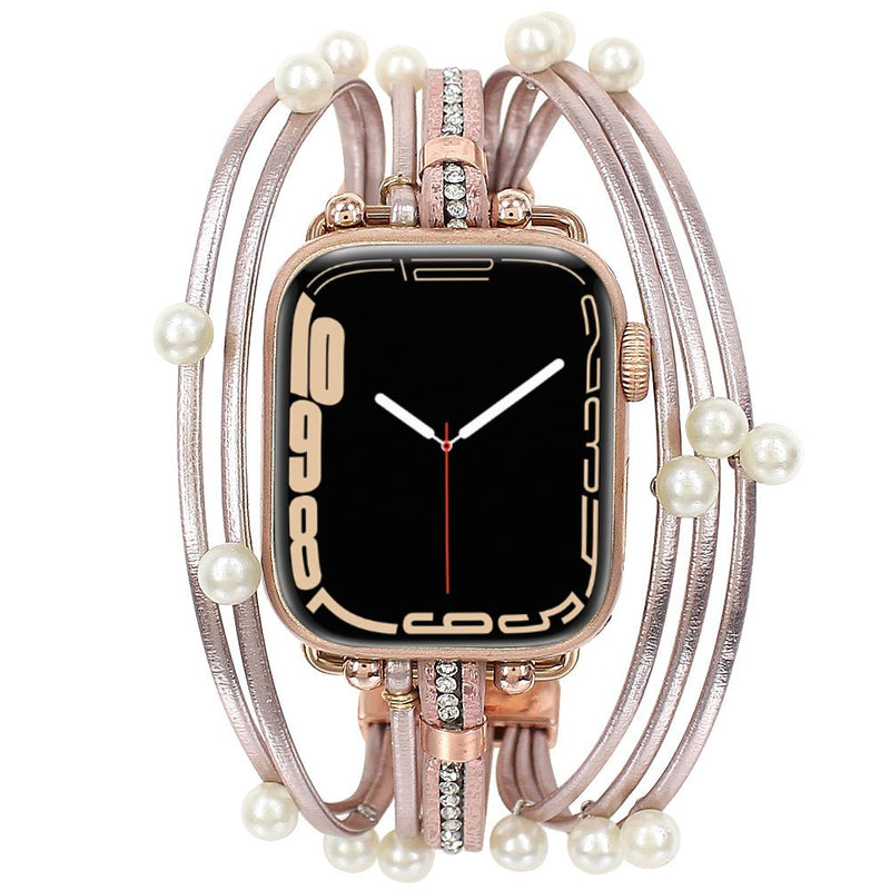 Bracelet multi-rangs rose pâle pour Apple Watch orné de perles blanches et strass scintillants.