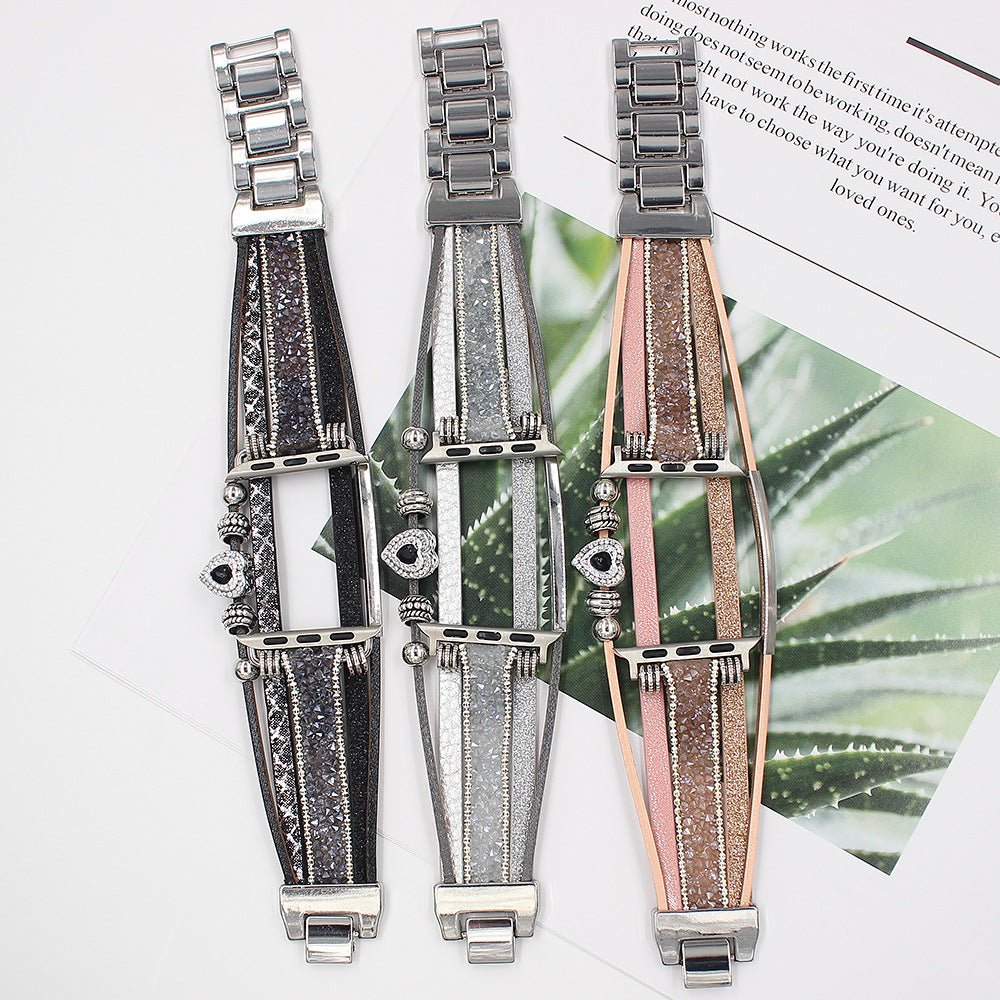 Bracelet multi-rangs en métal avec éclat pailleté et charm cœur, disponible en argent, noir et rose, pour Apple Watch.