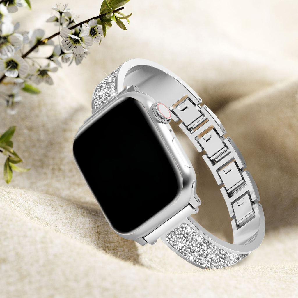 Bracelet Apple Watch argent pailleté pour femme avec maillons élégants et fermoir métallique.
