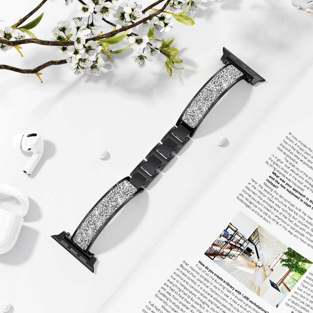 Bracelet Apple Watch noir pailleté pour femme avec boucle métallique noire.