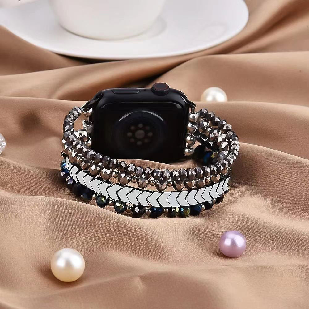 Bracelet pour Apple Watch noir avec cristaux scintillants et maillons argentés élégant.