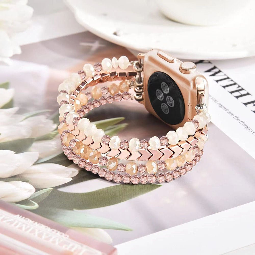Bracelet rose scintillant en cristal pour Apple Watch avec fermoir métallique rose pâle.