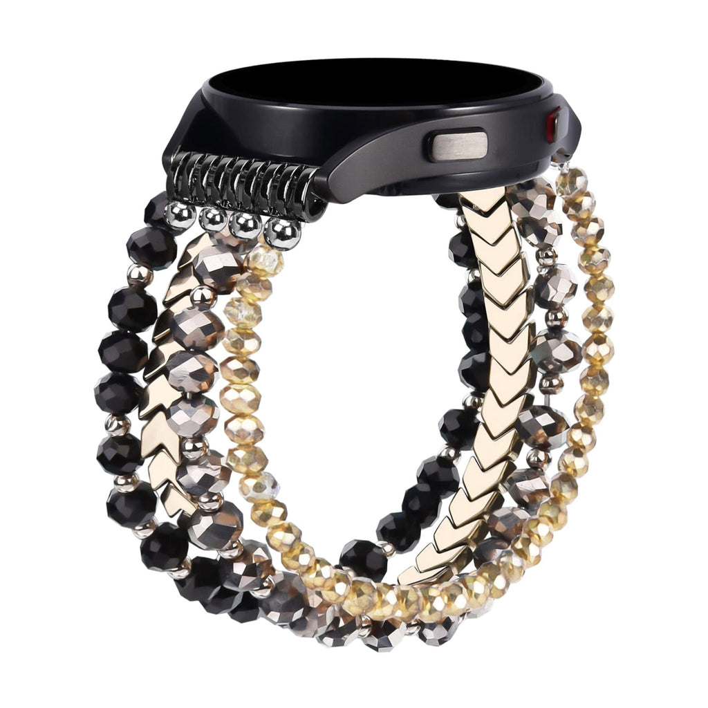 Bracelet Lévana pour Samsung Galaxy Watch en cristaux noirs, gris et dorés, design élégant et scintillant.