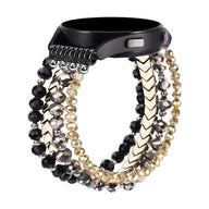 Bracelet Lévana pour Samsung Galaxy Watch en cristaux noirs, gris et dorés, design élégant et scintillant.