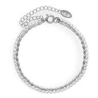 Bracelet double chaîne argent en titane avec petites pierres incrustées et fermoir mousqueton.