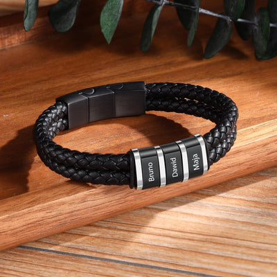 Bracelet homme double cordon cuir noir tressé avec plaque métal gravée noms.