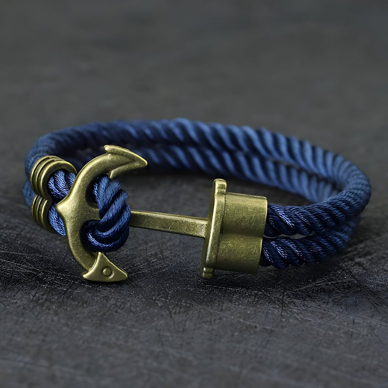 Bracelet double cordon bleu avec motif ancre antique en métal vieilli.
