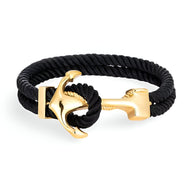 Bracelet double cordon noir avec motif ancre dorée en métal brillant, modèle Umber.