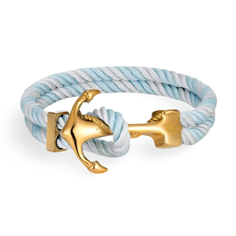 Bracelet double cordon bleu et blanc avec motif ancre dorée style marin élégant.