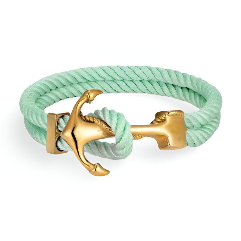 Bracelet double cordon vert menthe avec motif ancre dorée en métal poli.