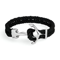Bracelet double cordon noir avec motif ancre argentée en acier inoxydable.