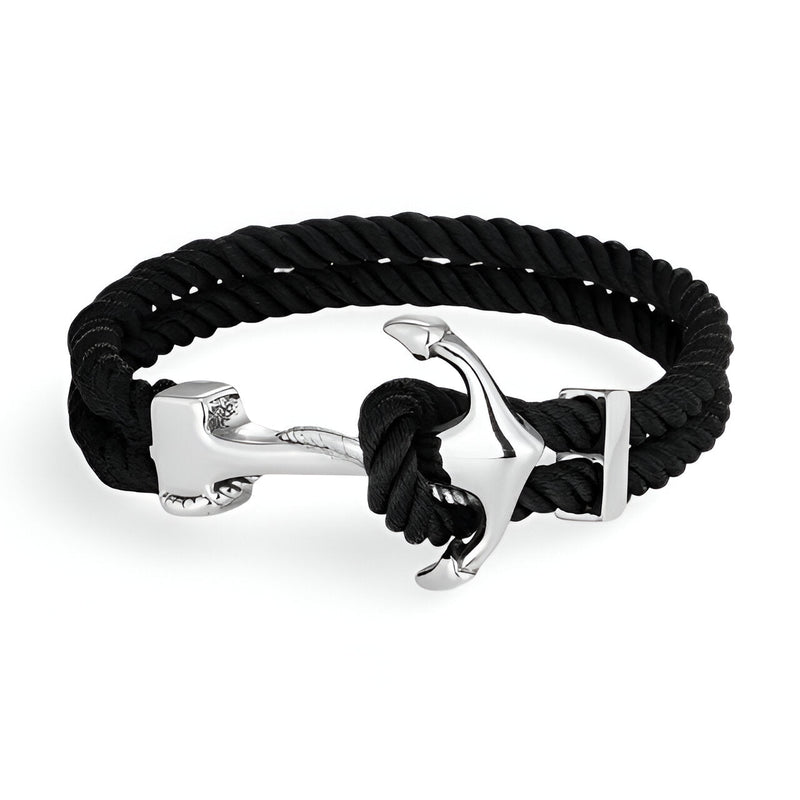 Bracelet double cordon noir avec motif ancre argentée en acier inoxydable.
