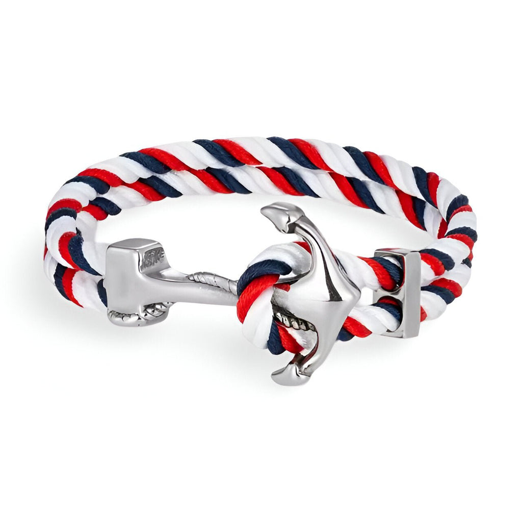 Bracelet double cordon rouge, blanc et bleu avec motif ancre argentée brillante.