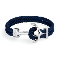 Bracelet double cordon bleu marine en corde avec motif ancre argentée brillante.