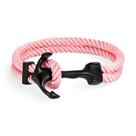 Bracelet double cordon rose avec motif ancre noire en métal style marin.