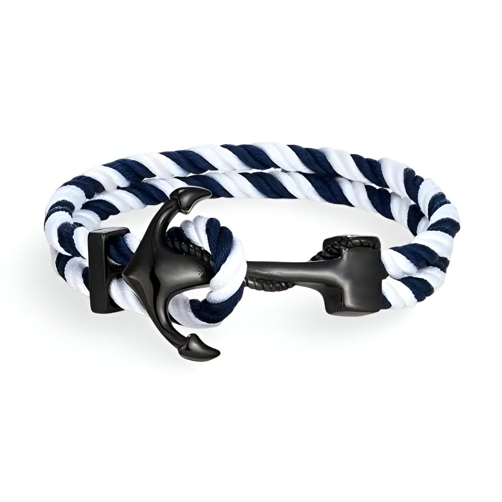 Bracelet double cordon bleu et blanc avec motif ancre noire en métal, style marin.
