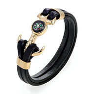 Bracelet homme double cordons cuir noir avec ancre marine dorée et boussole colorée intégrée.