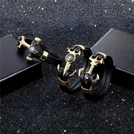 Bracelet homme double cordons noirs avec ancre marine et boussole dorées élégantes.