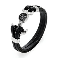 Bracelet homme double cordons noirs en cuir avec ancre marine argentée et boussole centrale.