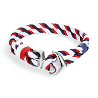 Bracelet marin double cordons bleu, blanc, rouge avec ancre en métal argenté.