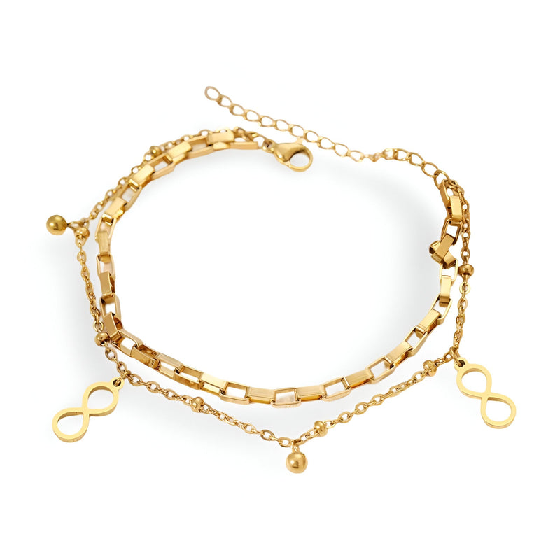 Bracelet double or en acier inoxydable avec charms infini et maillons variés pour femme.