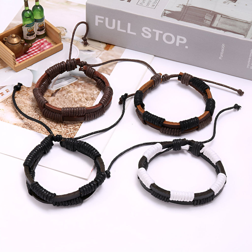 Quatre bracelets doubles en cuir ciré, couleurs marron, marron et noir, noir, noir et blanc, style tressé avec cordons.