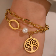 Bracelet double en acier inoxydable or avec chaîne maillons ovales, perle blanche et pendentif arbre de vie mini.