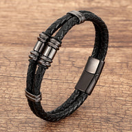 Bracelet double-rangs en microfibre tressée noire avec détails métalliques gris foncé et fermoir magnétique.