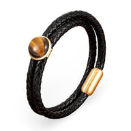 Bracelet double-rangs en cuir tressé noir avec pierre œil de tigre ronde et fermoir doré mat.