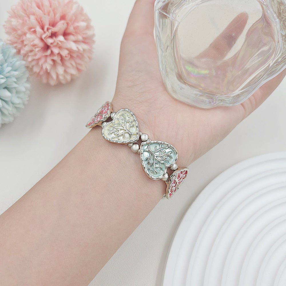 Bracelet Apple Watch elastique, maillons coeur emailles motif arbre de vie, modele Cabra