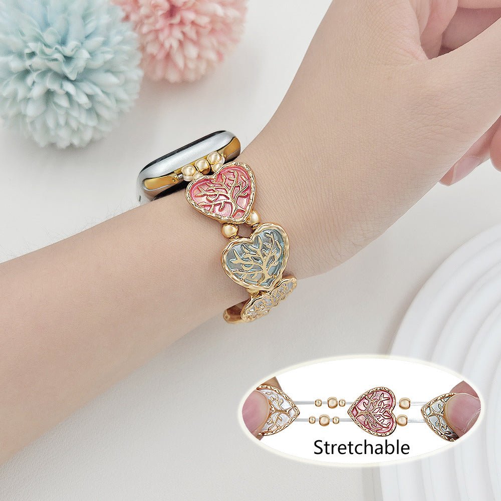 Bracelet Apple Watch elastique, maillons coeur emailles motif arbre de vie, modele Cabra