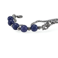 Bracelet homme en acier inoxydable avec perles rondes d'aventurine bleu profond et maillons argentés raffinés.