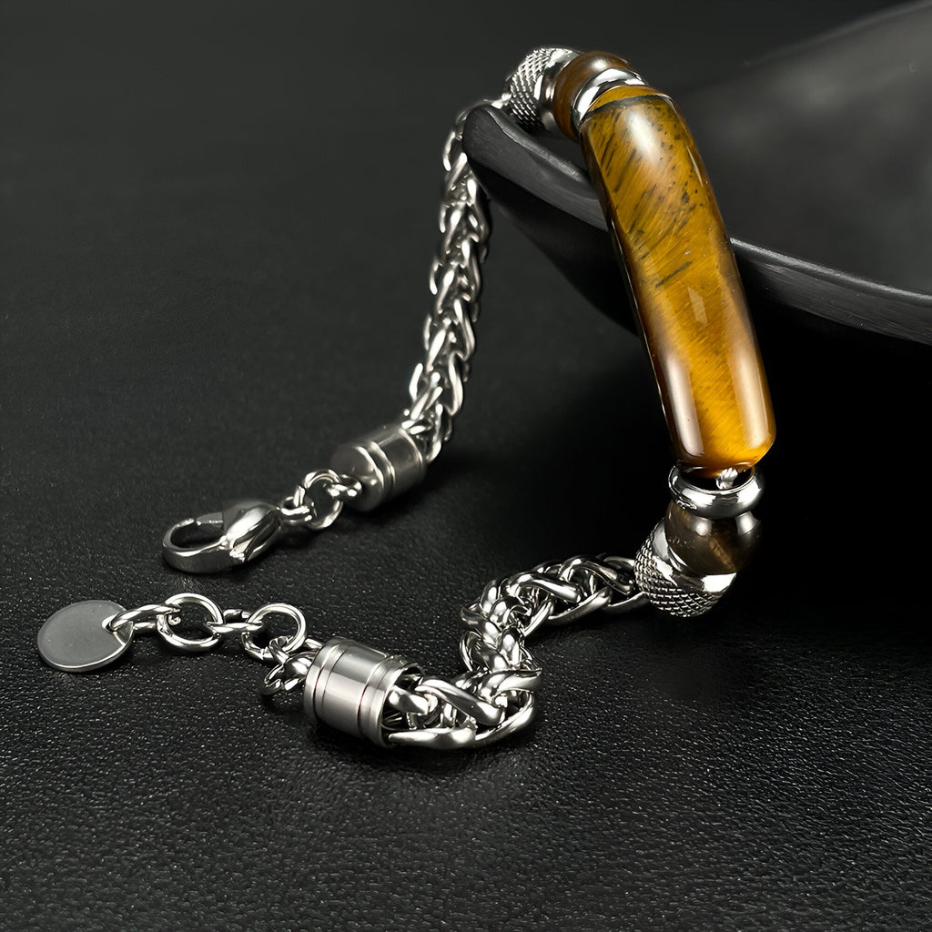 Bracelet homme en acier inoxydable avec pierre œil de tigre ovale marron et chaîne argentée robuste.