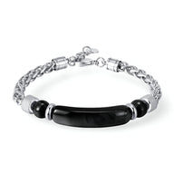 Bracelet homme en acier inoxydable argenté avec pierre d'œil de tigre noire et chaîne maillon robustes.