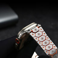 Bracelet Halo en acier inoxydable argent et orange avec motif géométrique pour Apple Watch.