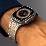 Bracelet Apple Watch en acier inoxydable argent avec motifs hexagonaux orange, ajustable, modèle Halo.