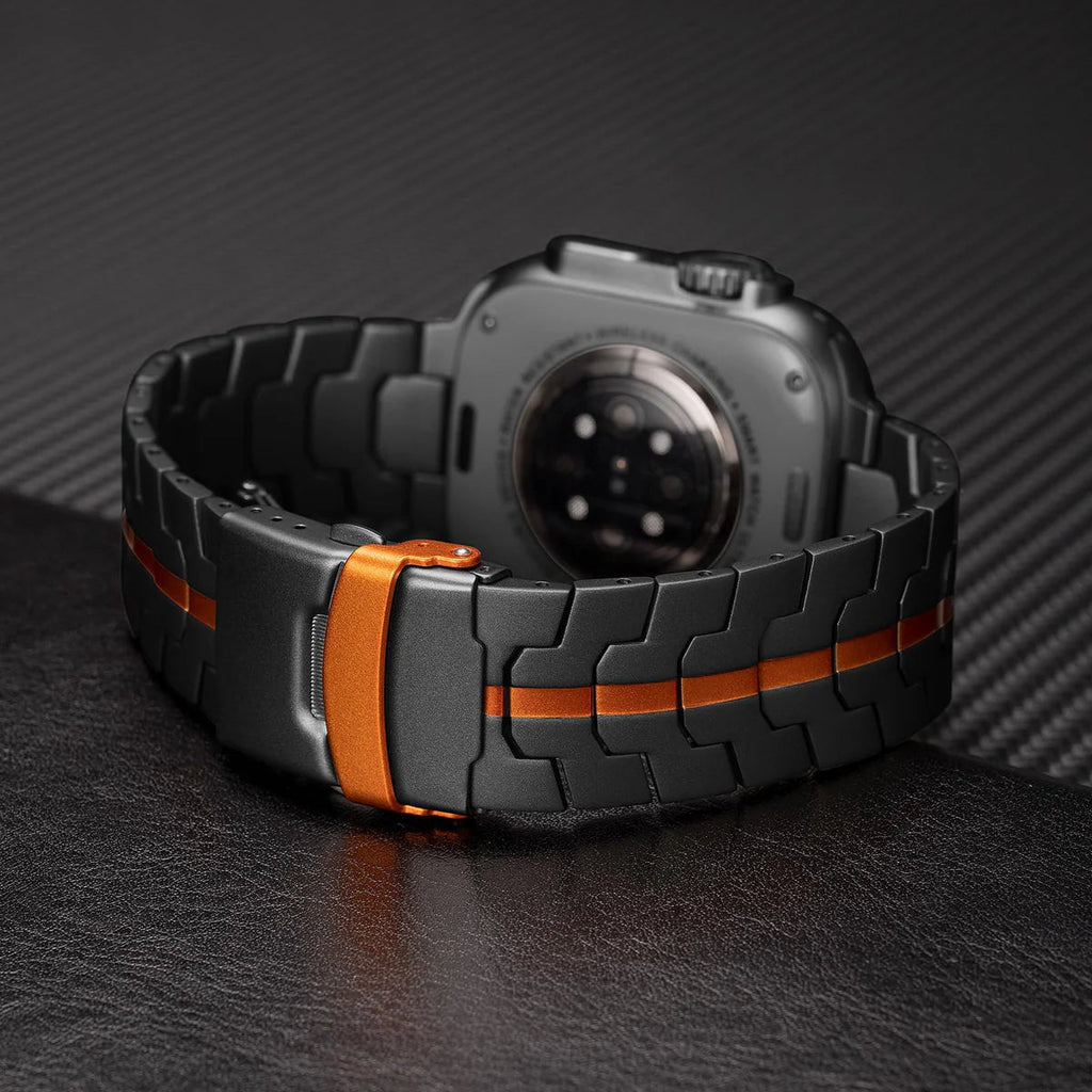 Bracelet en acier inoxydable noir avec ligne orange, style maillons larges, pour Apple Watch.