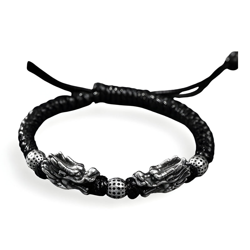Bracelet homme en argent massif tressé noir avec double tête de dragon argentée et perles texturées.