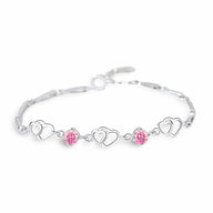 Bracelet en argent massif avec charms cœurs entrelacés et cristaux roses éclatants.