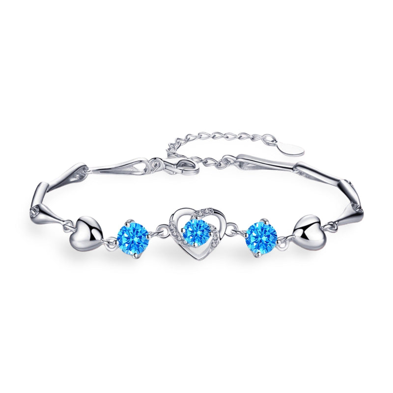 Bracelet en argent avec charmes cœur et cristaux bleus étincelants, modèle Stacy pour femme.
