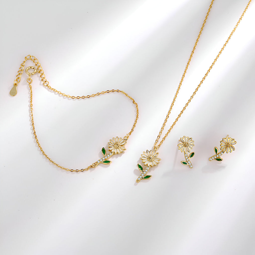 Bracelet en or avec pendentif marguerite et chaîne fine élégante.