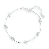 Bracelet en argent sterling fin avec petits nœuds perlés espacés et fermoir réglable.