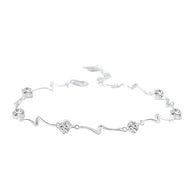 Bracelet en argent sterling avec motifs ondulés et fleurs délicates, style océanique.