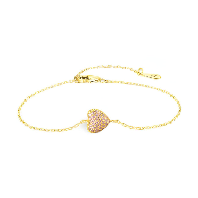 Bracelet fin en or avec cœur pavé de petits zircons, fermoir à mousqueton ajustable.