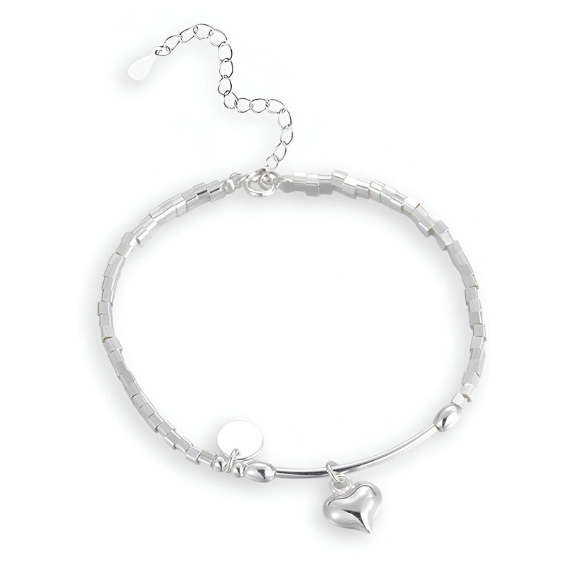 Bracelet en argent sterling pour femme avec chaîne fine et pendentif coeur lisse suspendu.