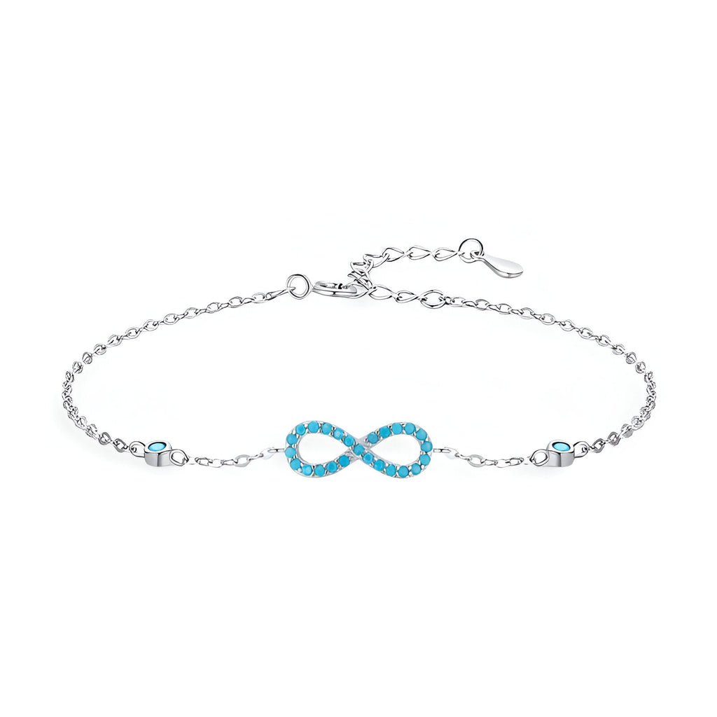 Bracelet en argent sterling avec charm infini orné de petites turquoises, design délicat pour femme.