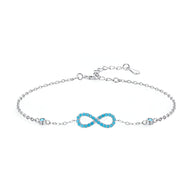 Bracelet en argent sterling avec charm infini orné de petites turquoises, design délicat pour femme.
