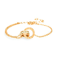 Bracelet en titane or rose avec deux cercles entrelacés et chiffres romains gravés sur chaîne fine.