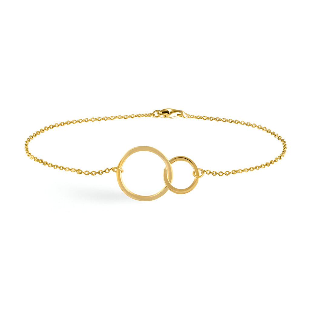 Bracelet fin en or avec deux cercles entrelacés sur chaîne délicate.
