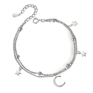 Bracelet en argent sterling avec pendentifs lune et étoiles scintillantes, chaîne fine double.